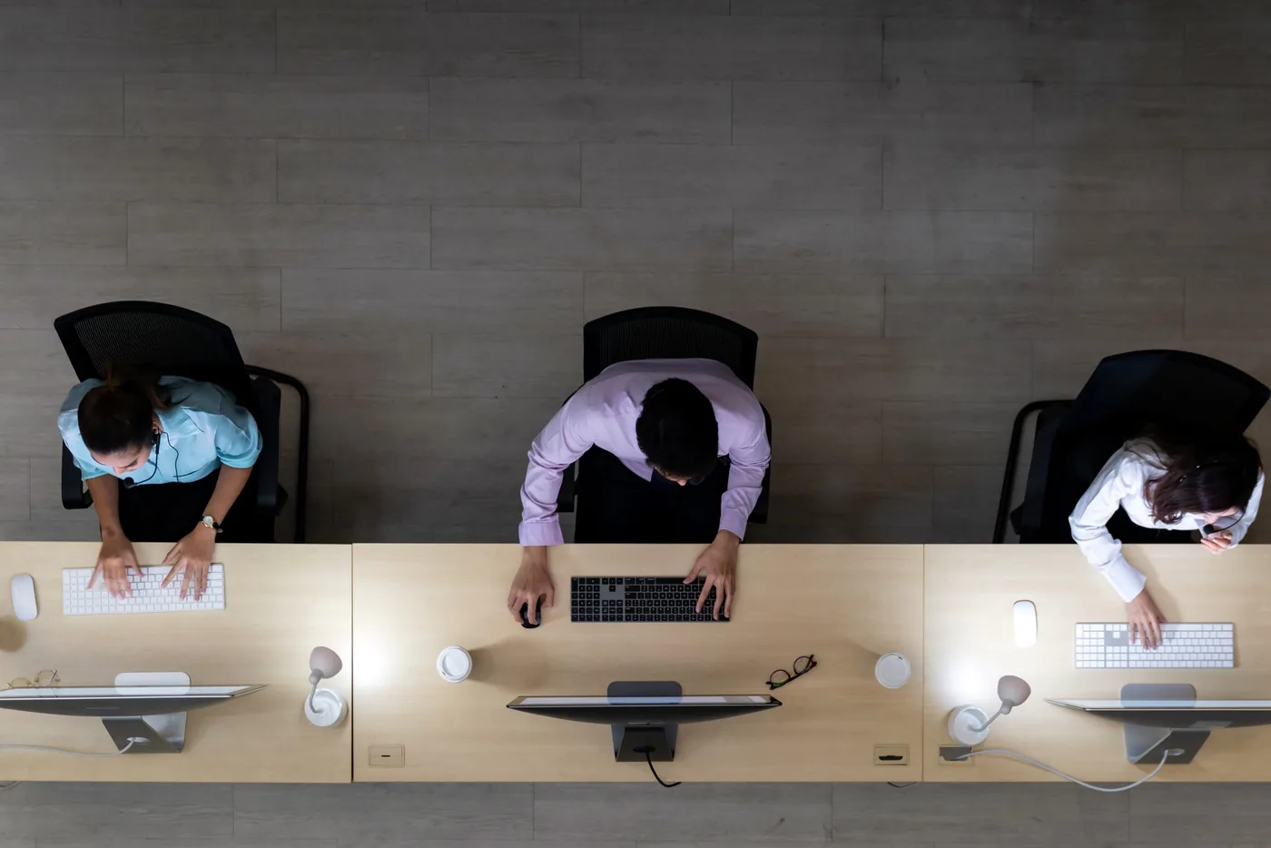 AppCentral team members at work in an open-plan office, seen from above